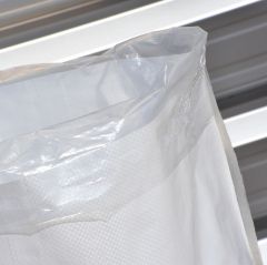 Corner of Woven polypropylene sacks with leak-proof liner folded over the top